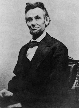 Abraham_Lincoln_half_length_seated,_April_10,_1865