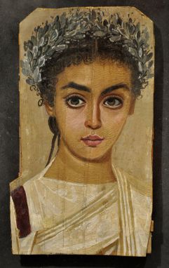 Many Fayum paintings – like this portrait of a girl dated to roughly 120-150 AD – feature subjects with abnormally large eyes. Are these paintings examples of Roman-era kitsch, the products of artists of limited talent – or a deliberate feature with religious overtones?